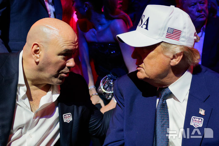 President Donald Trump, right, listens to UFC President and CEO Dana White during UFC Freedom 250 on the South Lawn of the White House, Monday, June 15, 2026, in Washington. (Evan Vucci/Pool Photo via AP)