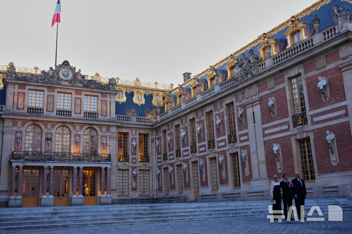 U.S. President Donald Trump is greeted by French President Emmanuel Macron and first lady Brigitte Macron at the Palace of Versailles, Wednesday, June 17, 2026, in Versailles, France. (AP Photo/Julia Demaree Nikhinson)