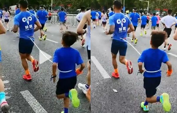 [서울=뉴시스] 24일 홍콩 사우스차이나모닝포스트(SCMP)는 중국 허난성 정저우에서 열린 마라톤 대회에 9세 소년을 데리고 참가한 남성이 대회 규정을 위반해 징계를 받았다고 보도했다. (사진=X 캡처)